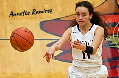 Image of girls basketball player, Annette Ramirez, Sarcoxie High School (Missouri), hown passing the ball to our left, in her white #11 uniform.