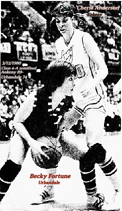 Image of Becky Fortune, Urbandale High School (Iowa) hunched over, attempting to drive around Ankeny's Cherie Anderson, in the MArch 12, 1980 Class 4-A semifinal game, won by ANkeny, 89 to 74. From the Des Moine Tribune, Des Moines, Iowa, 3/13/1980.