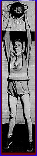 Image of basketball player Bradford LAir, all 6 feet 9 and three-quarter inches, standing on tip-toes n uniform with big M on front (for Monticello High School in Kentucky facing front holding ball up high next to basket. From The Courier-Journal, Louisville, Ky., February 9, 1930.