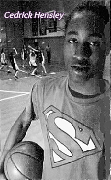 Posed picture of boys basketball player, Cedrik Hensley, Heritage Christian Academy (Texas), in Superman logo shirt. From the Daily World, Opelousas, Louisiana, January 21, 2001.
