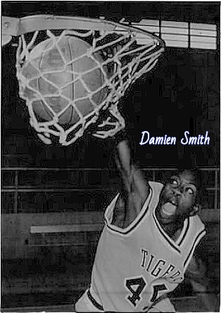 Picture of Mississippi boys basketball player, DDamien Smith (Hattiesburg High School Tigers), shown dunking the basketball in TIGERS #45 uniform. From the Sunday American, Hattiesburg, Mississippi, November 15, 1992. Photo by Robert Miller
