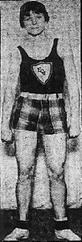 Image of Babe Didrickson, Dallas Cyclones A.A.U. women's basketball player, posing in plaid shorts with hands at sides. From The Wichita Eagle, Wichita, Kansas, March 30, 1930.