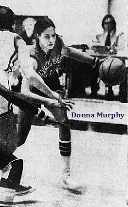 IMage of girls baketball player, Donna Murphy, driving around the defense in a game. From the MArch 29, 1975 Courier-Jurnal from Louisville, Kentucky. Photo by Michael Coers