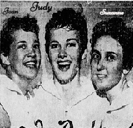 Celebratory image of the 19th District Tournament semi-final in which Judy Eller (center) scored 48 points for a 67-43 win over Hillsboro. To her right (our left) is Jean Worley and on her other side is Suzanne Evans. Teammates celebrating. From The Tennessean, Nashville, Tenn., February 28, 1958. Phoo by Jimmy Holt.