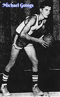 Image of boys basketball player Michael Goings, Robeline High School, Louisiana, shown bending over, white top, black shorts, looking to pass the basketball to our right. From the Shreveport Journal, Shreveport, Louisiana, January 21, 1970.