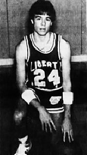 Image of Texas boys basketballer Phillip Lenox, Liberty Hill High School, on his left knee in uniform #24. From the Austin American-Statesman, Austin, Texas, JAnuary 8, 1967.