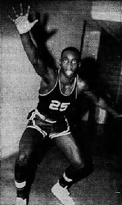 Posed image of boys basketball player, Leonard Poole, Breckenridge County High School (Kentucky), in uniform #25, playing defense. From the Messenger and Inquirer, Ownsboro, Kentucky, December 29, 1963.