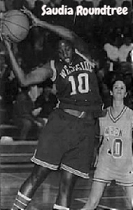 Image of #10, Saudia Roundtree, girls basketball player, Anderson West Side High School (South Carolina) up in air, coming down with a rebound, againt Wren High, 1/31/1992. From The Greenville News, Greenville, S.C., February 1, 1992. Photo by Bart Boatwright.