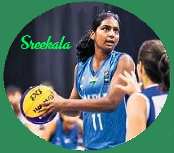 Image of girls basketball player Sreekala Rani, with basketball looking to shoot, in Indian National team blue uniform #11 in 2019.