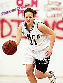 Image of girls basketball player Stefanie Collins, Odessa-Montour High School (New York) dribbling upcourt in her O.M.C.S. number 21 uniform, c.2000-01.