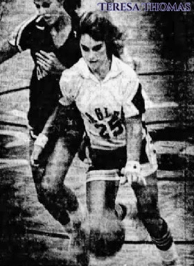 Image of Louisiana girls basketball player Teresa Thomas, Trinity Heights High, driving downcourt, past defender, with basketball, in #25 uniform. From the Shreveport Journal, November 21, 1981, Shreveport, Louisiana. Photo by Ralph Fountain.