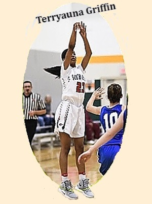 Image from a three-quarters angle, in air, in white uniform #23, is Tennessee girls basketball player Terryana Gridding of the South-Doyle High School team. Shown shooting a jump shot..