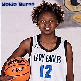Image of girls basketball player Yakia Burns, Porter's Chapel Academy (Mississippi), in LADY EAGLES uniform #12, looking ahead with basketball at her right side..