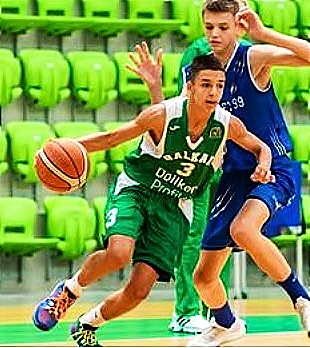Number 3, in green uniform, Alexander Gavalyugov Bulgarian U14 players for BC Balkan, shown dribbling around a efener in the championship game he scored 50 points in.