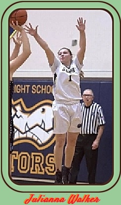State of Washington girls basketball player , Julianna Walker, Annie Wright High School, up in the air on defense, arms up, trying to block a shot. Wearing white uniform, number one.