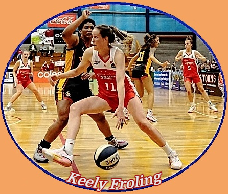Image of Keely Froling, Australian basketball player for the Launceton Tornadoes of the N.B.L. One South, in #11 red and white uniform, driving around a defender in black and orange.