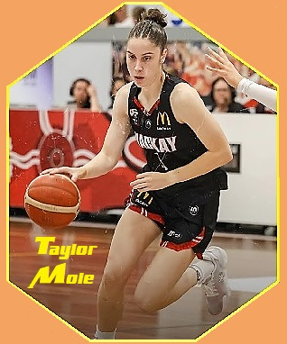 Actin shot of Australian women's basketball player Taylor Mole, Mackay Meteorette driving the ball for a shot.