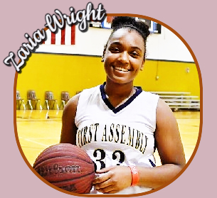 Image of Zaeia Wright, First Assembly Academy, Concord, North Carolina basketball player, number 32, holding basketball, posing.