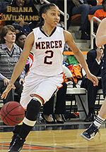 Briana Williams, Mercer College women's basketball player, dribbling ball.