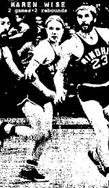 Image of Karen Wise, Windham College baasketball player, playing with male teammates in game. She is running downcourt with two of her bearded teammates on either side. From The Kingsport News. Kingsport, Tennessee, January 28, 1972.