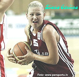 Diana Ozolina, RCHV basketball player, in later photograph (from http://www.parsportu.lv ), driving up the court, sternly.