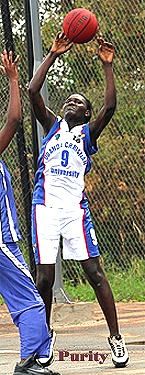 Image of Purity Odhiambo (aka Adhiambo), #9 for the Uganda Christian University women's basketball team, shooting against IUIU on March 29, 2014. Photo (cropped) by John Batanude.