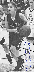 Image of Tiffany Rieger, Burlington Lady Elk (Oklahoma) basketball player, driving with the ball. Froom The Kiowa News, Kiowa, Kansas, December 19, 2012..