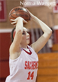 Norma Waggett, Saugus High School Sachems basketball player, in Massachusetts, number 14, shooting a basket.