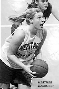 image of Kentucky girls basketball player for Heritage Academy, shooting a foul shot to our right (as sophomore). Photo by Sarah Conard from The Courier-Journal, Louisville, Kentucky, Fb. 11, 2005.