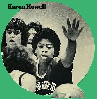 Close-up image of Karon Howell, state of Oregon goirls basketball player, on defense with left hand guarding the ball, playing for St. Mary's Academy, Portland, c.1984. 