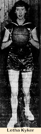 Image of girls basketball player, Letha Kyker, Lamar High School, Tennessee, holding ball with both hands. From the Johnson City Press-Chronicle, March 11, 1951.