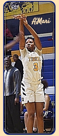Image of girls basketball player, A'Mari Wheatley, of Warrensville Heights High School, Ohio, taking a jump shot in white uniform with yellow lettering. TIGERS #3.