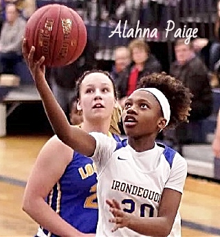 Image of Alahna Paige, Irondequoit High School (New York) girls basketball player, #20, going up for a one-handed lay-up.