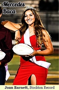 Photo (cropped) of Stagg High School homecoming queen, September 10, 2021 (Stockton, California). In red gown, with crown, leaning on king, holding white football. Photographer Joan Barnett for the Stockton Record,